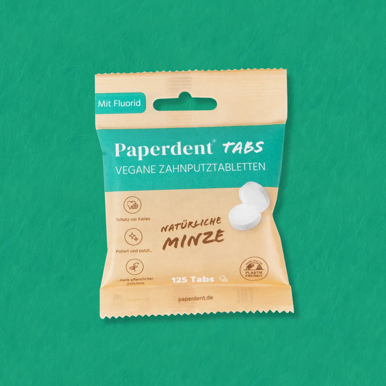 Paperdent Vegane Zahnputz-Tabletten grüner Hintergrund